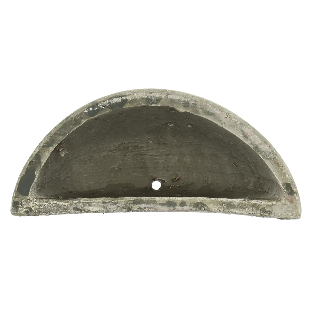 Aged ceramic wall planter hanging decoratively with screws, functional for plant display.