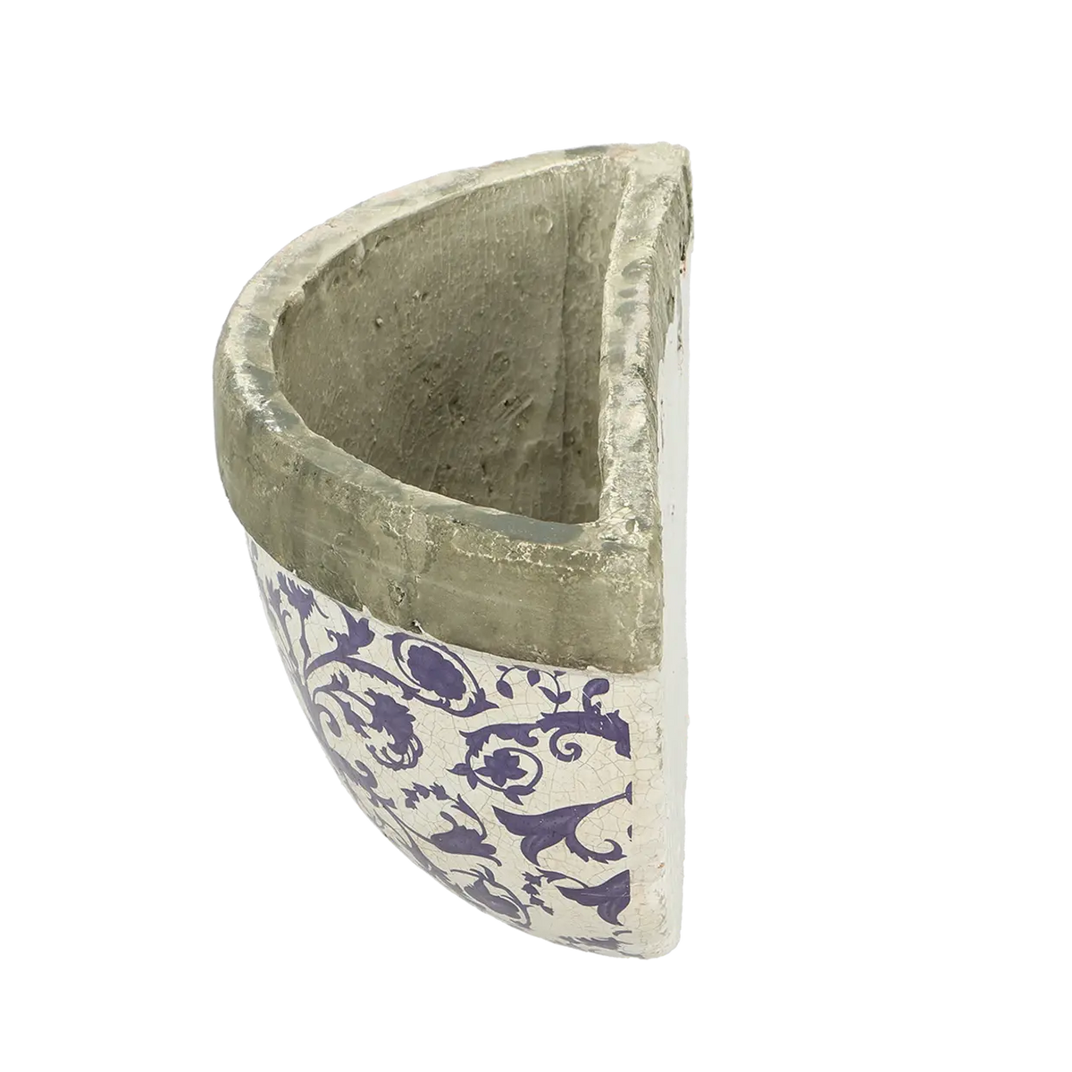 The aged ceramic wall planter in a garden setting, showcasing how it enhances outdoor spaces.
