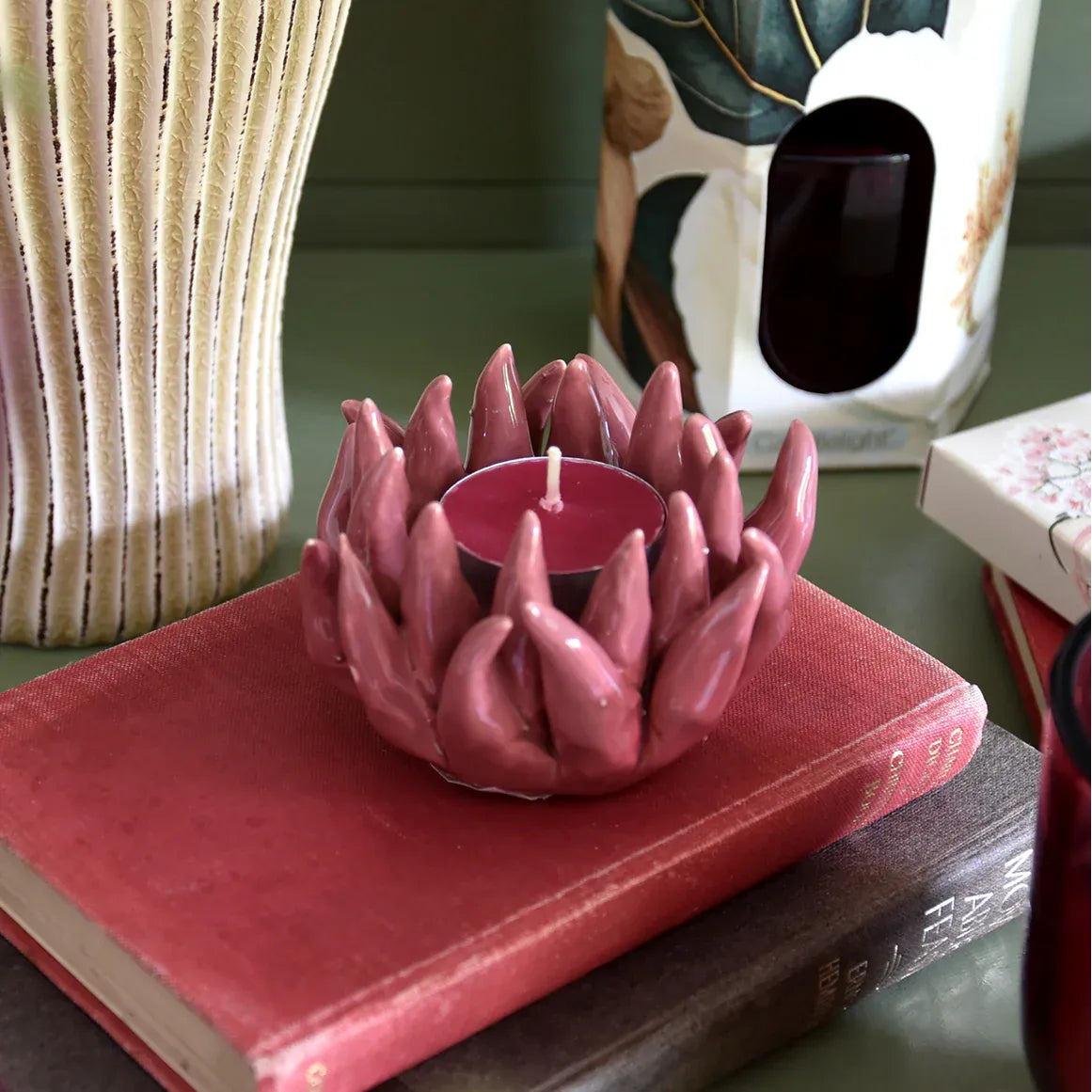 Stylish Flower Shaped Tealight Holder - Pink displayed on a table, perfect for creating a warm ambience with this flower tealight holder.