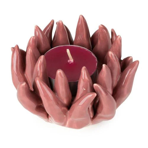 Flower Shaped Tealight Holder in pink with tealight lit, demonstrating the warm glow of this elegant flower tealight holder.