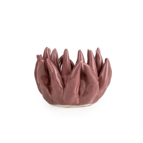 Flower Shaped Tealight Holder in pink amongst flowers, highlighting the beauty and elegance of this flower tealight holder.