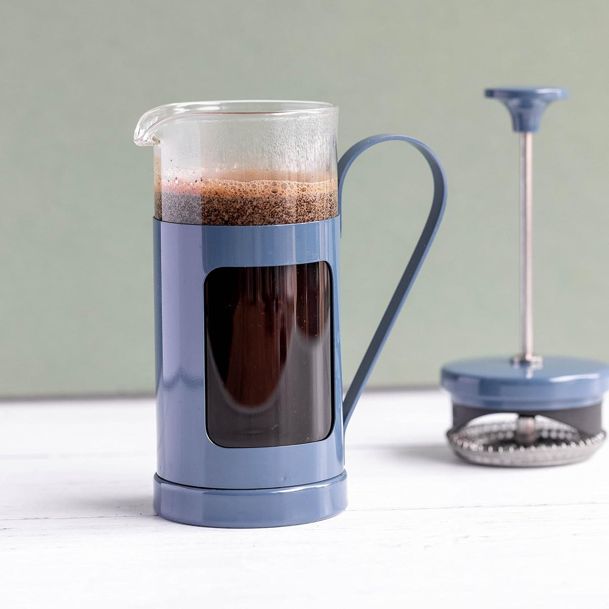 Lifestyle image of La Cafetière Monaco Glass/Stainless Steel Cafetière 3 Cup being used to serve coffee, highlighting its elegant appearance as a glass cafetiere 3 cup.