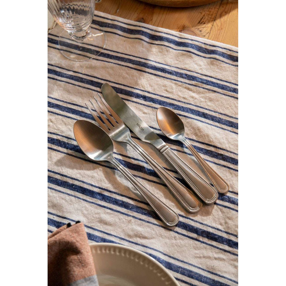 Mikasa Portobello Stainless Steel Cutlery Set, 16 Piece in a dishwasher, demonstrating its easy-care and dishwasher safe feature.