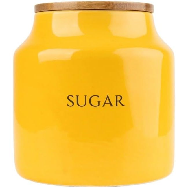 Clearly labelled Tomato Ceramic Canisters for Tea, Coffee and Sugar, ensuring easy identification and access to your kitchen staples.