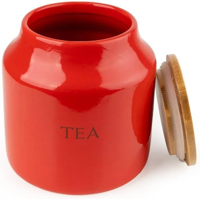 Stylish bamboo lids on Tomato Ceramic Tea Coffee Sugar Canisters, designed to seal in freshness while enhancing your kitchen decor.