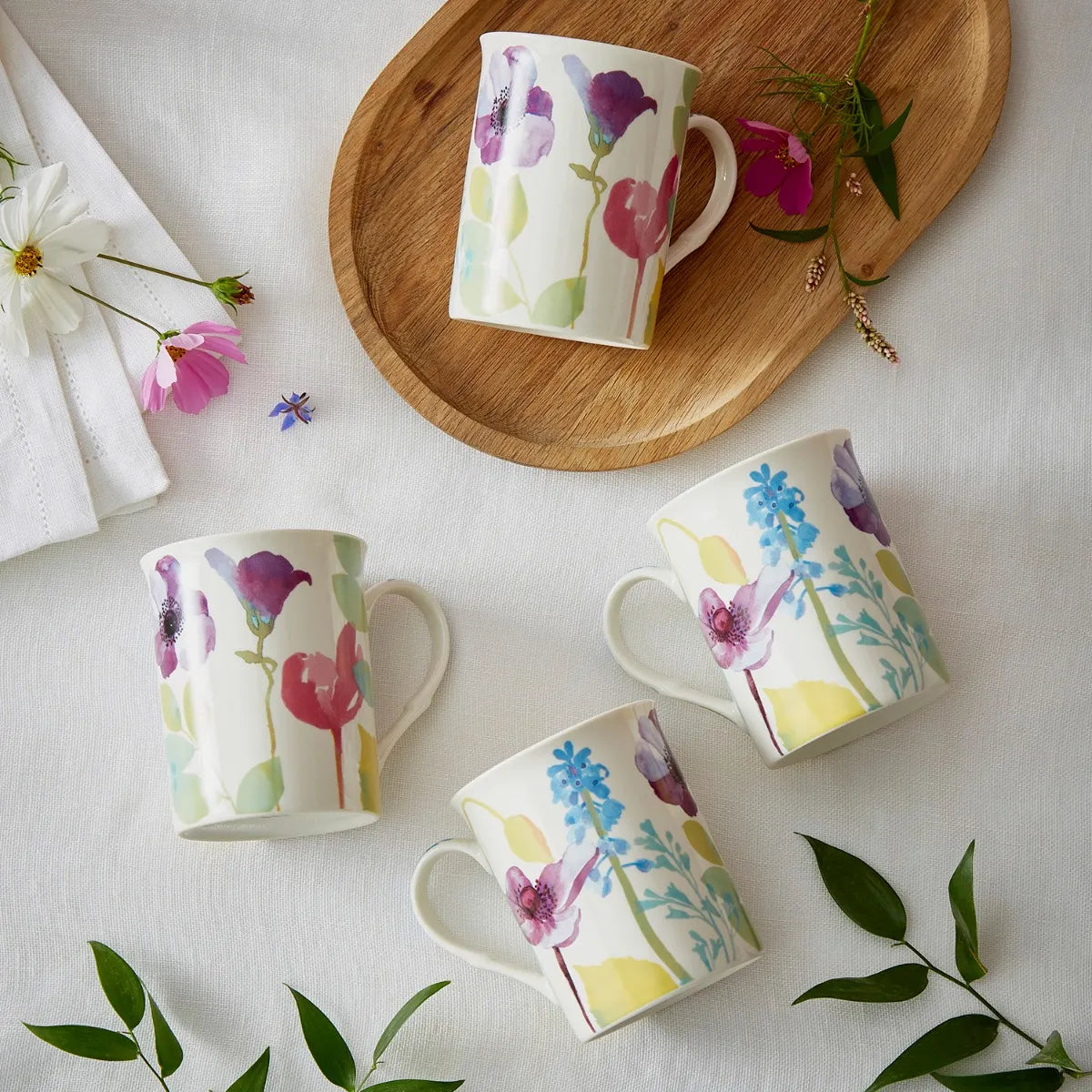 Elegant Portmeirion Water Garden Mugs set with stunning watercolour flowers in pink, blue, and purple, ideal for adding charm to your kitchen as water garden mugs.