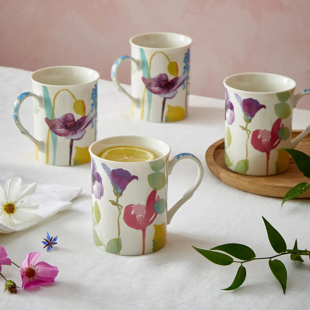 Beautifully crafted Portmeirion Water Garden Mugs showcasing a colourful floral pattern in pink, blue, and purple, designed for lovers of water garden mugs.