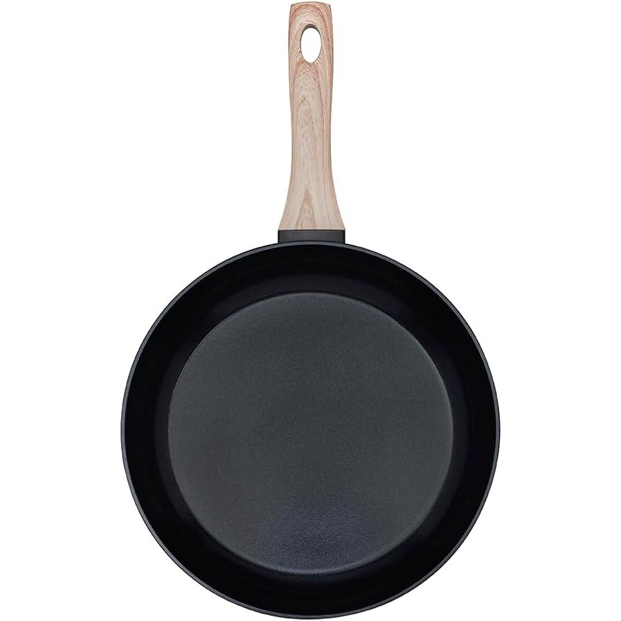 Top view of the Pyrex Cook & Care recycled aluminium frying pan, suitable for all heat sources, featuring a wood effect handle. Perfect for cooking.
