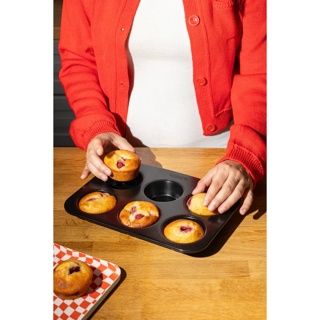 Pyrex Glide 6 Muffin and Cupcake Tray in a kitchen setting, demonstrating its perfect heat distribution for baking.