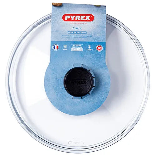 Pyrex 26cm glass lid displayed on cookware, demonstrating its perfect fit and versatility.