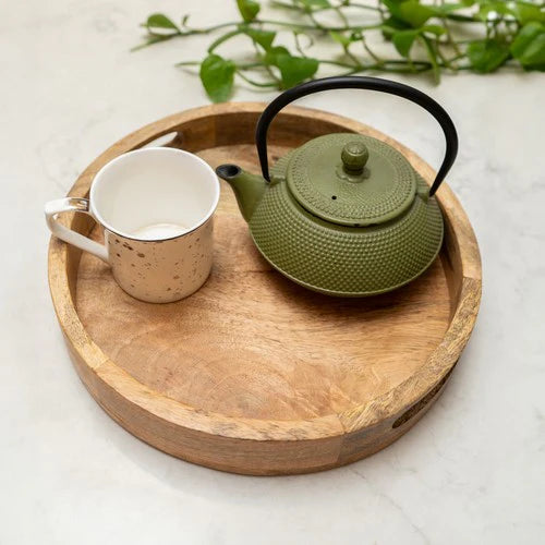 30cm Round mango wood serving tray on a table setting, perfect for serving drinks and enhancing home décor.