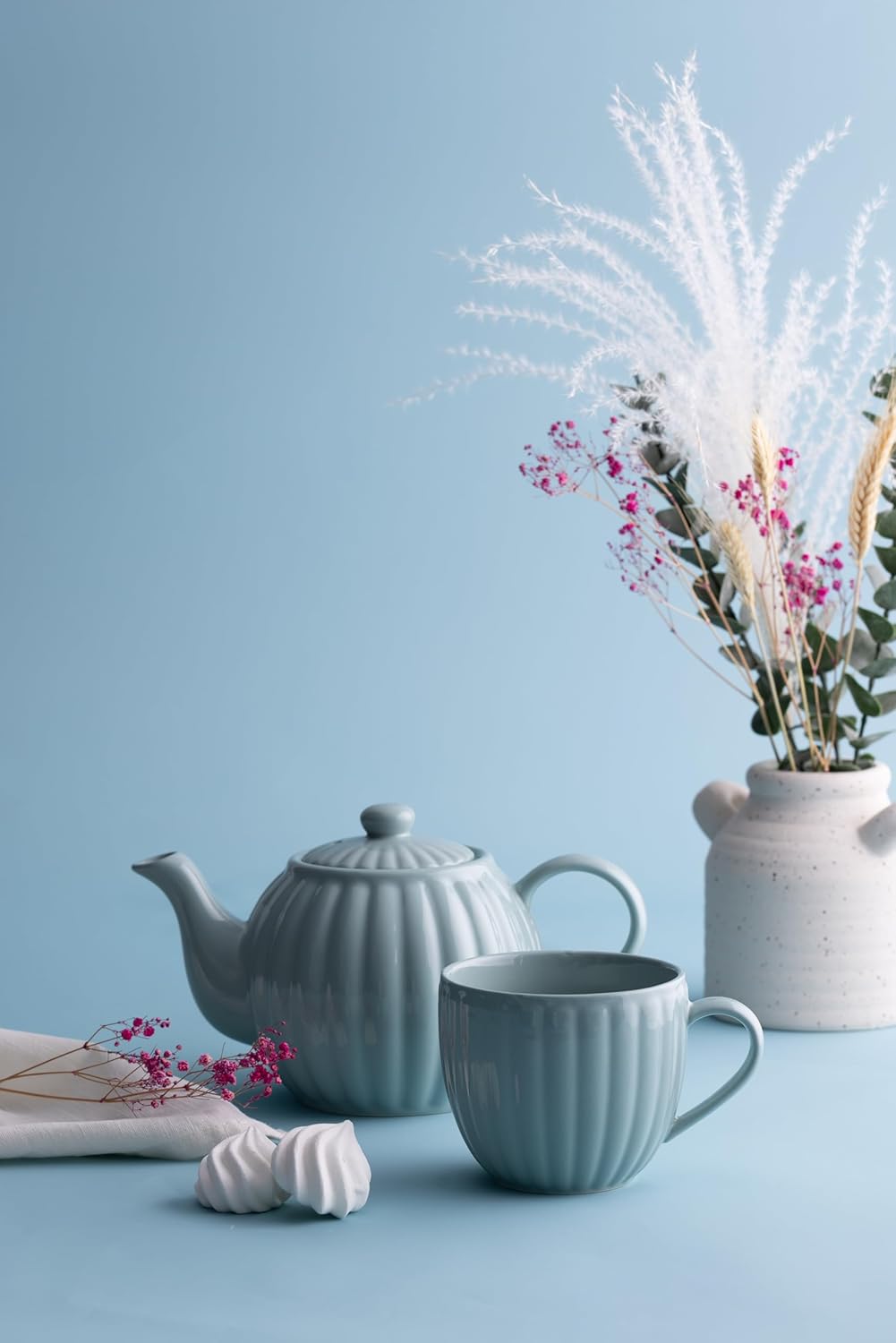 Create Unforgettable Tea Parties with the Lux Stoneware Collection featuring elegant teapots, cups, and platters designed for stylish gatherings.