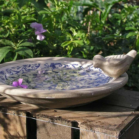 Garden Décor featuring an elegant cast iron birdbath with a vintage look, part of our premium range of garden décor accessories.