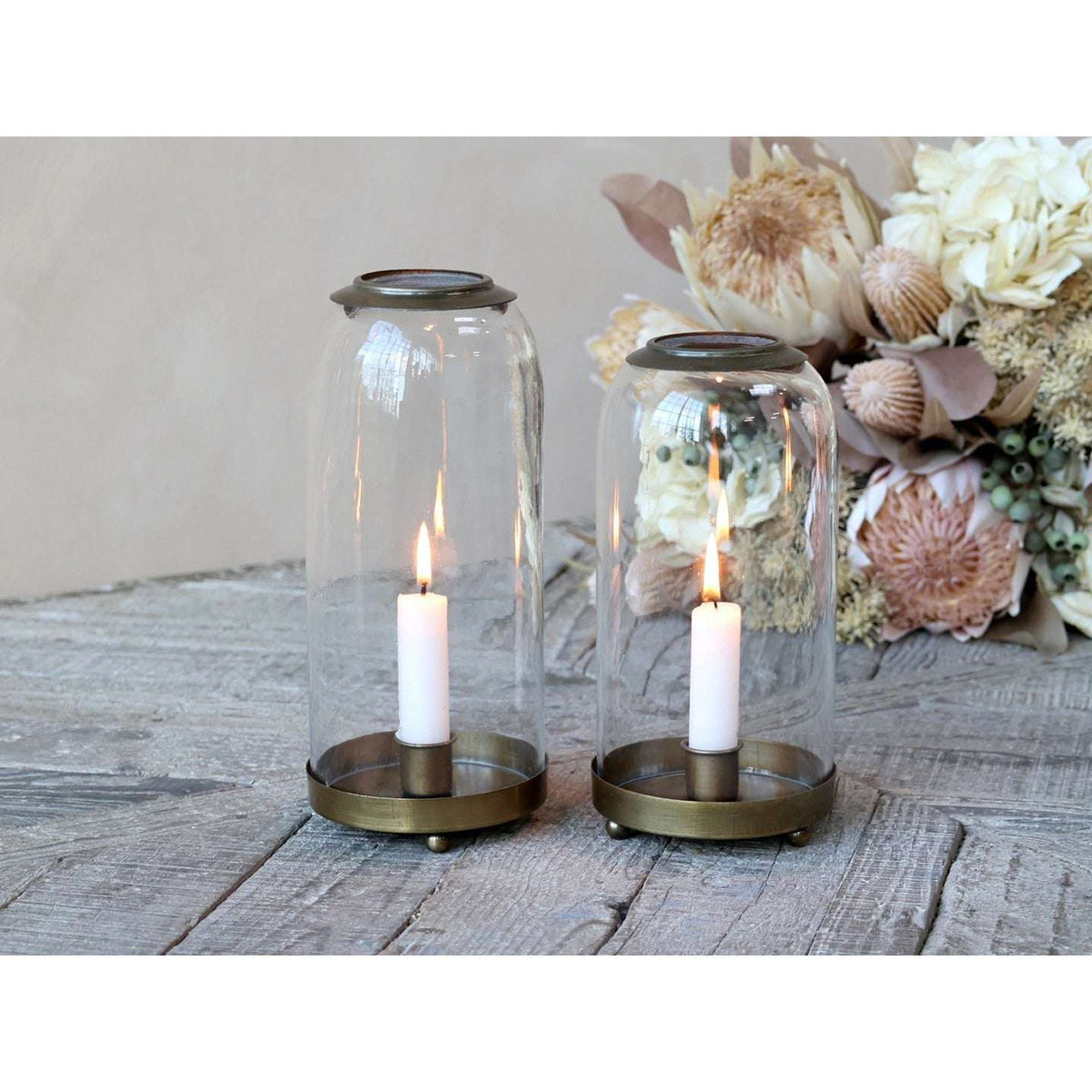 Stylish Candle Holders collection featuring decorative candle holders, including carved mango wood T-light holders, patterned glass tealight holders, and elegant antique silver candlesticks.