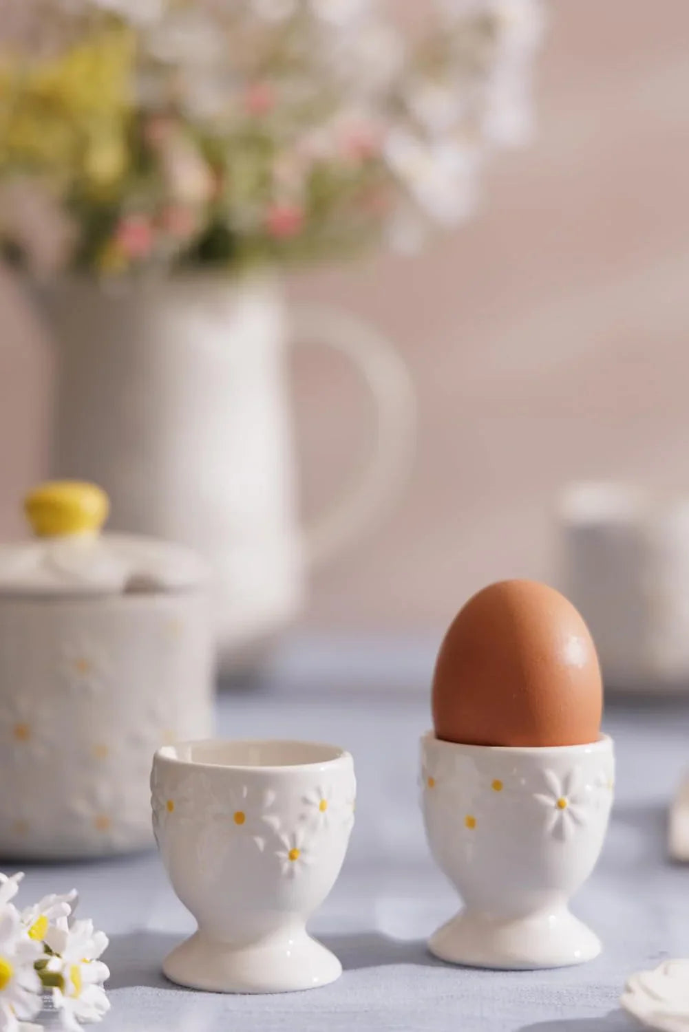 Charming ceramic salt and pepper shakers from the Salt & Pepper and Egg Cups collection, featuring unique designs and perfect for adding flair to your kitchen decor.