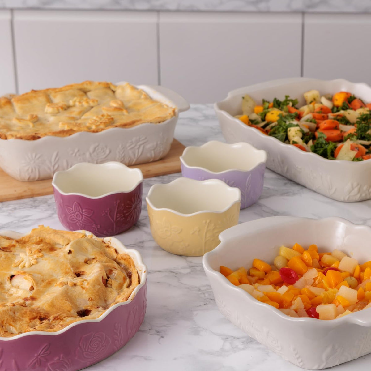 Mason Cash In The Meadow Collection featuring durable baking accessories, elegant floral design mixing bowls, and practical kitchen storage options.