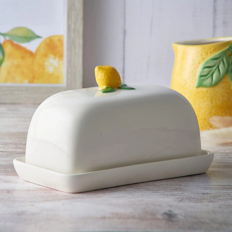 Charming lemon-themed ceramic butter dish with lid, perfect for keeping butter soft and stylishly displayed in your kitchen. Ideal for your Butter Dishes collection.