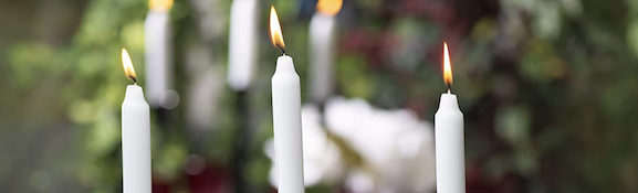 Elegant collection of unscented dinner candles, featuring Spaas and Price's high-quality taper candles in ivory, white, and red, ideal for any dining occasion.
