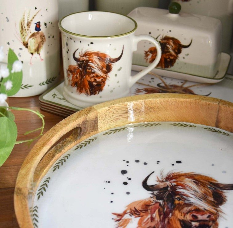 Highland Cow Kitchen and Storage Range featuring charming highland cow kitchen accessories, including egg cups, utensil holders, and butter dishes, perfect for rustic and country-style home décor.