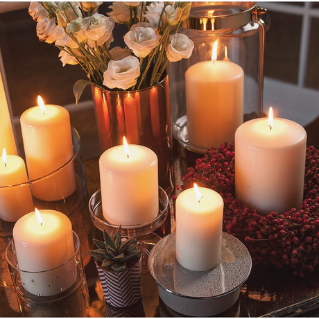 Pillar Candles collection featuring premium quality pillar candles in various sizes and burn times, including elegant unscented options in white, ivory, and red.