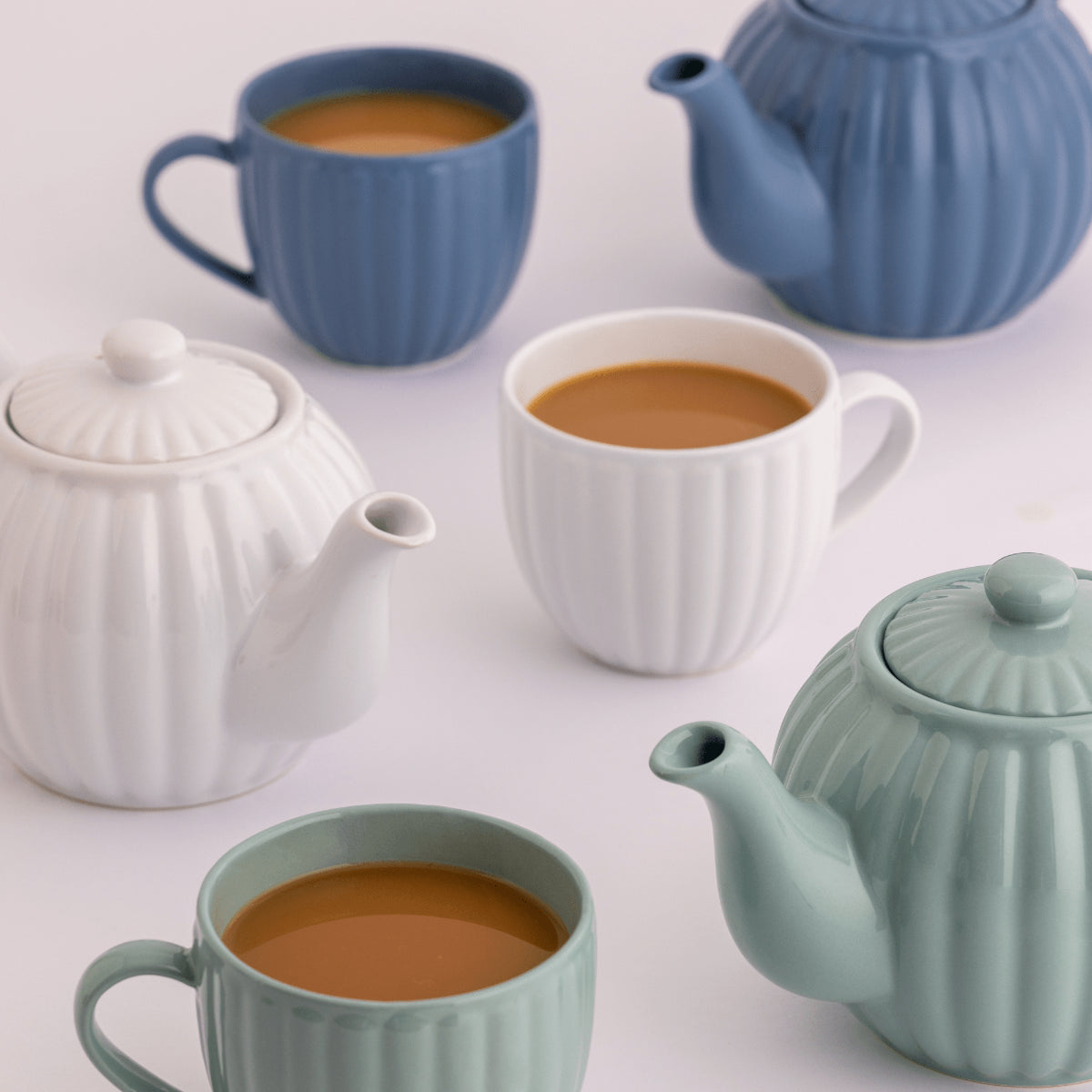 Price & Kensington modern kitchen tableware collection featuring a variety of elegant and durable stoneware, including teapots, cereal bowls, and storage jars.