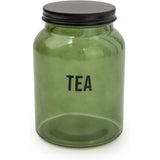 Chic Olives Apothecary green glass canisters with black lids, designed for tea coffee sugar storage in a modern kitchen.