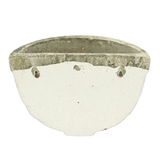 Beautifully arranged aged ceramic wall planter filled with flourishing flowers, adding charm to interiors.