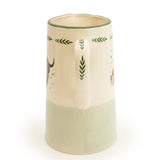 Elegant Highland Cow Ceramic Jug filled with cream, demonstrating its versatile usage as a highland cow jug for serving at the dining table.