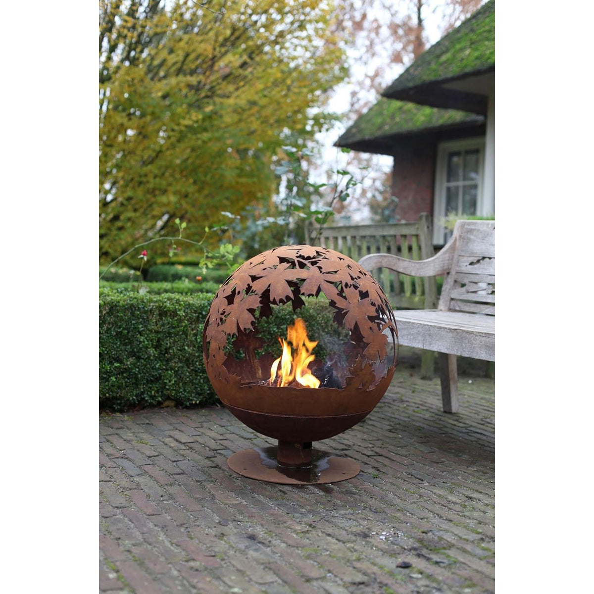 Rusty finish of the laser cut fire pit showcasing detailed leaf patterns, ideal for adding charm to your garden.