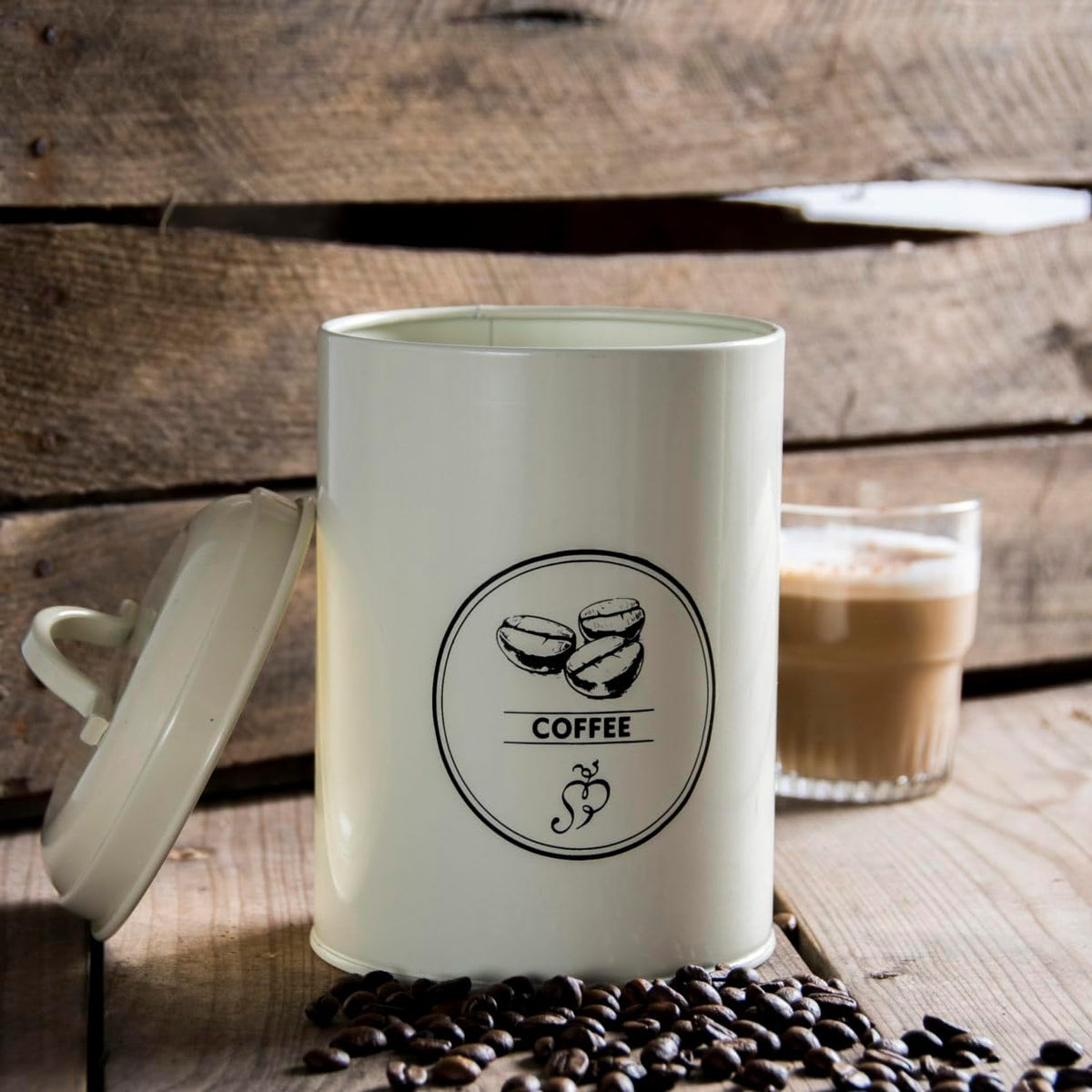 Easy to clean cream tea, coffee, and sugar canisters for a neat farmhouse kitchen storage solution.