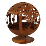 Fire ball laser cut rust woodland laser cut fire pit surrounded by natural elements in an outdoor space.