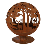 Fire ball laser cut rust woodland laser cut fire pit glowing at night, perfect for chilly evenings.