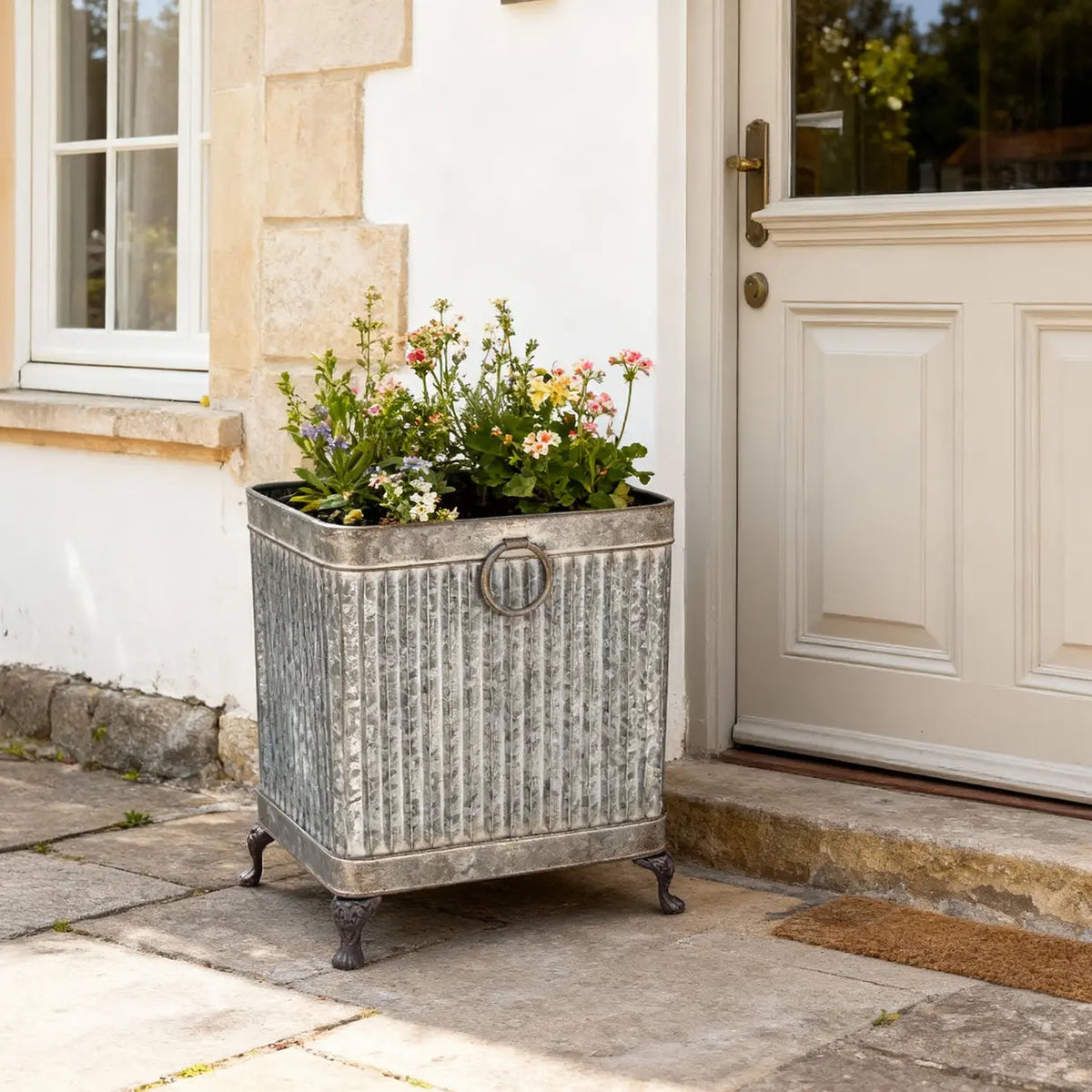 Elegant footed planter square set of 3 zinc - stylish outdoor garden planters ideal for showcasing small shrubs and plants.