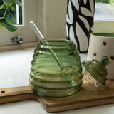 Green Glass Honey Jar with Bee Lid, perfect for storing honey, sugar or preserves, featuring a cork lid and a gentle green hue.