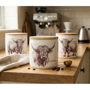 Highland Cow Ceramic Canister Set - Stylish ceramic kitchen containers with charming Highland cow design, perfect for tea, coffee, and sugar storage.