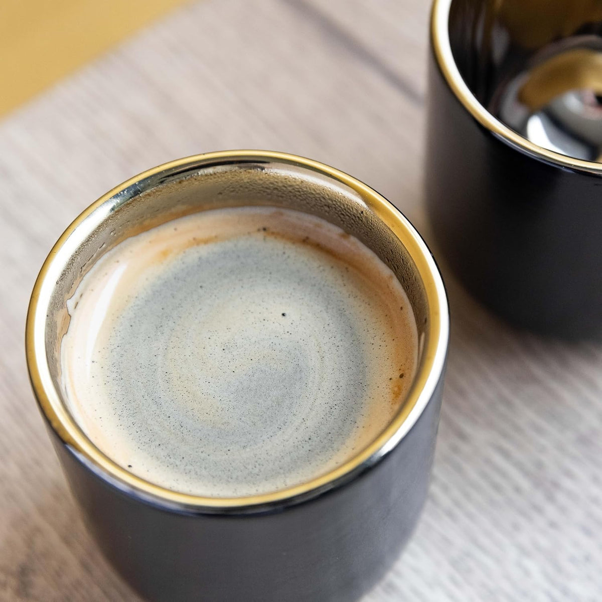 La Cafetière's Double Walled Espresso Mugs stacked together, showcasing their stylish and functional design.