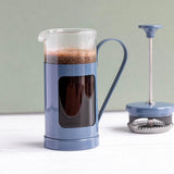 Lifestyle image of La Cafetière Monaco Glass/Stainless Steel Cafetière 3 Cup being used to serve coffee, highlighting its elegant appearance as a glass cafetiere 3 cup.