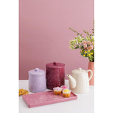 Mason Cash in The Meadow Teapot 800ml paired with treats and a bouquet, demonstrating its use as a durable stoneware teapot for delightful gatherings.