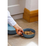 Mason Cash Reactive Paw Large Dog Bowl against a rustic backdrop, emphasizing its durable stoneware construction for lasting use.