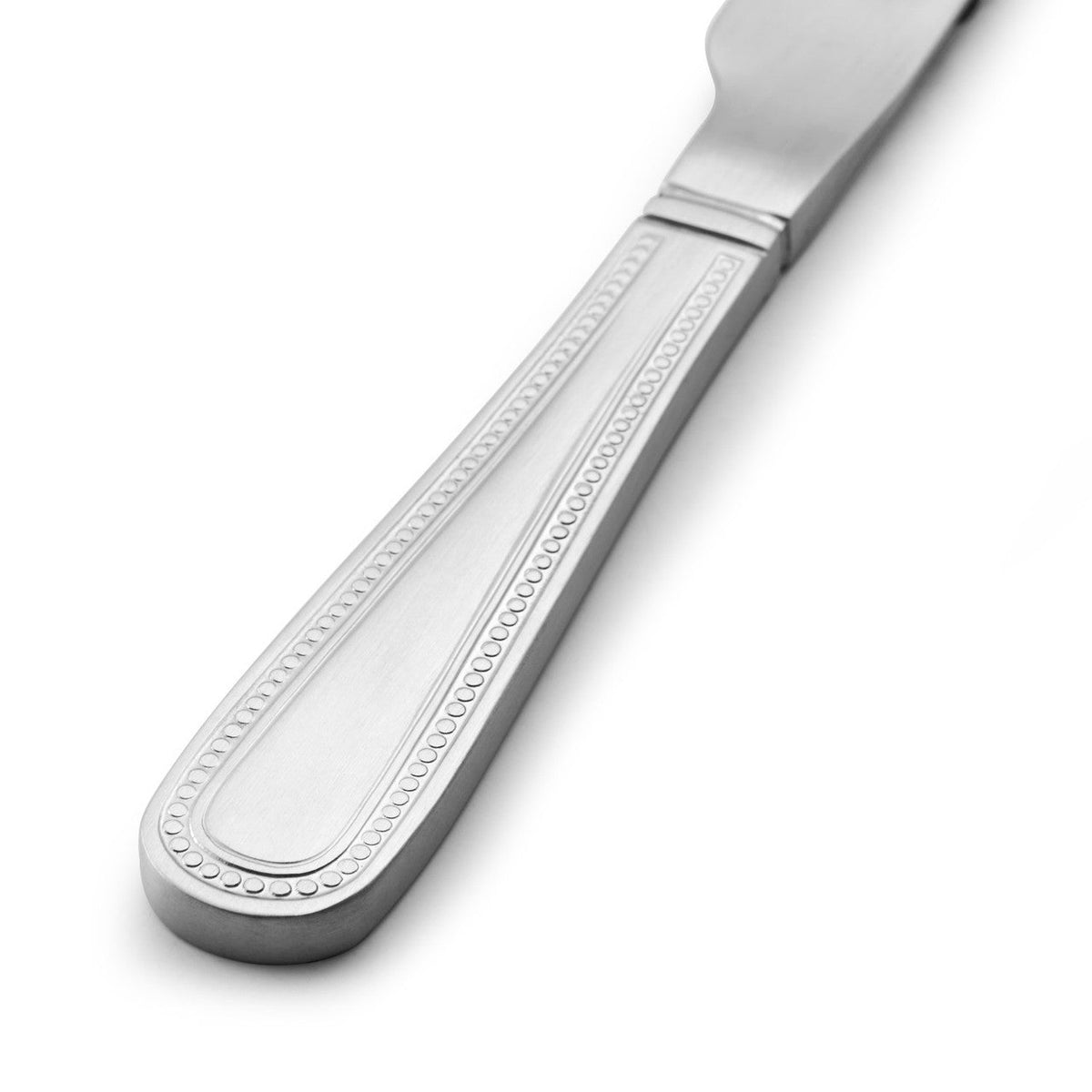 The Mikasa Portobello Stainless Steel Cutlery Set, 16 Piece arranged for a dinner setting, illustrating its sophisticated design.