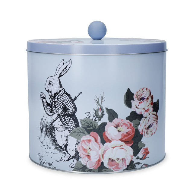 Mikasa and the V&A Alice In Wonderland Biscuit Tin featuring whimsical illustrations and pastel colours.