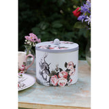 Mikasa and V&A Alice In Wonderland Biscuit Tin in a kitchen setting, showcasing its storage practicality.