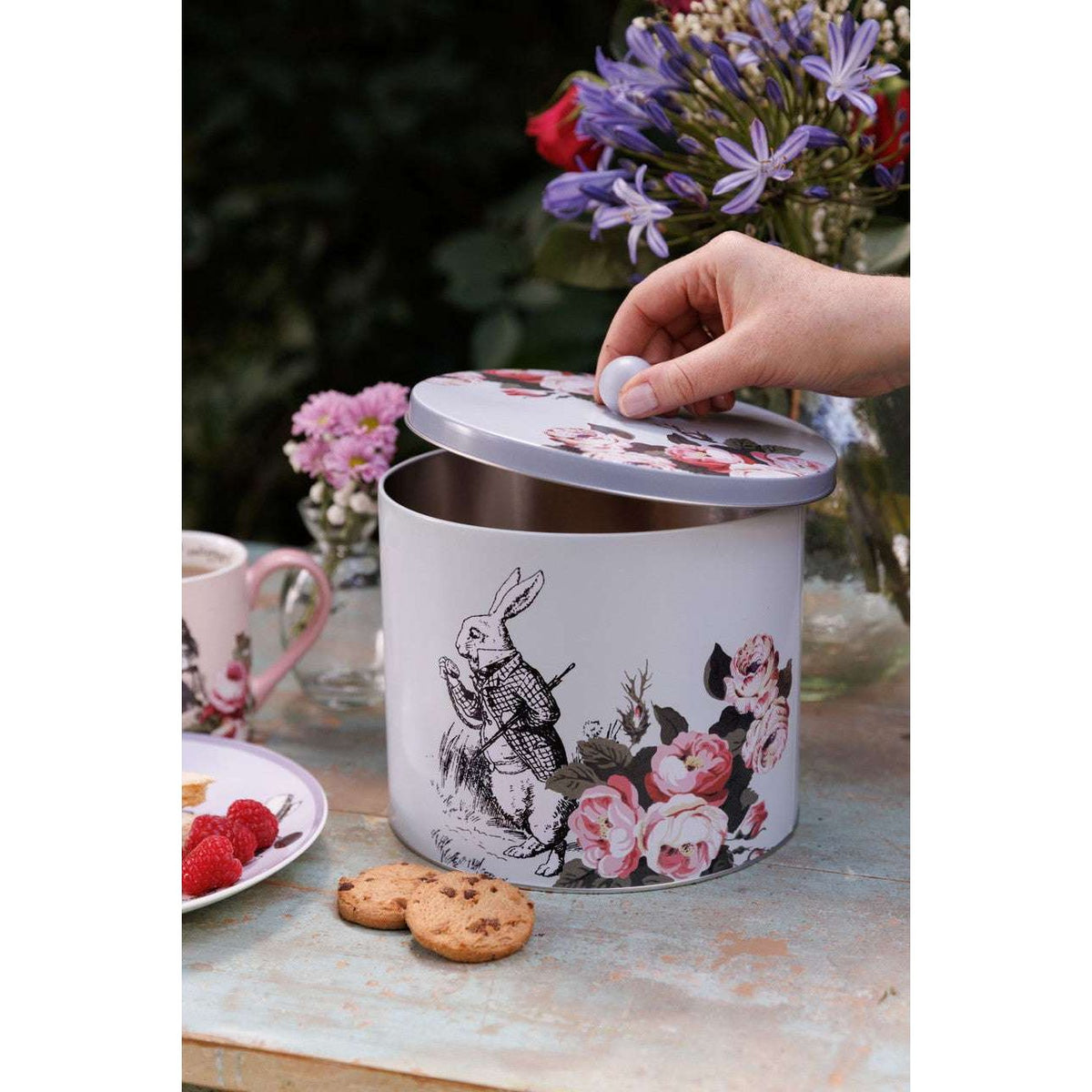 Mikasa and V&A Alice In Wonderland Biscuit Tin in pastel colours, an essential for any biscuit lover.