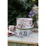The smaller Mikasa Alice In Wonderland Cake Tin, highlighting its compact size for cupcakes and pastries.