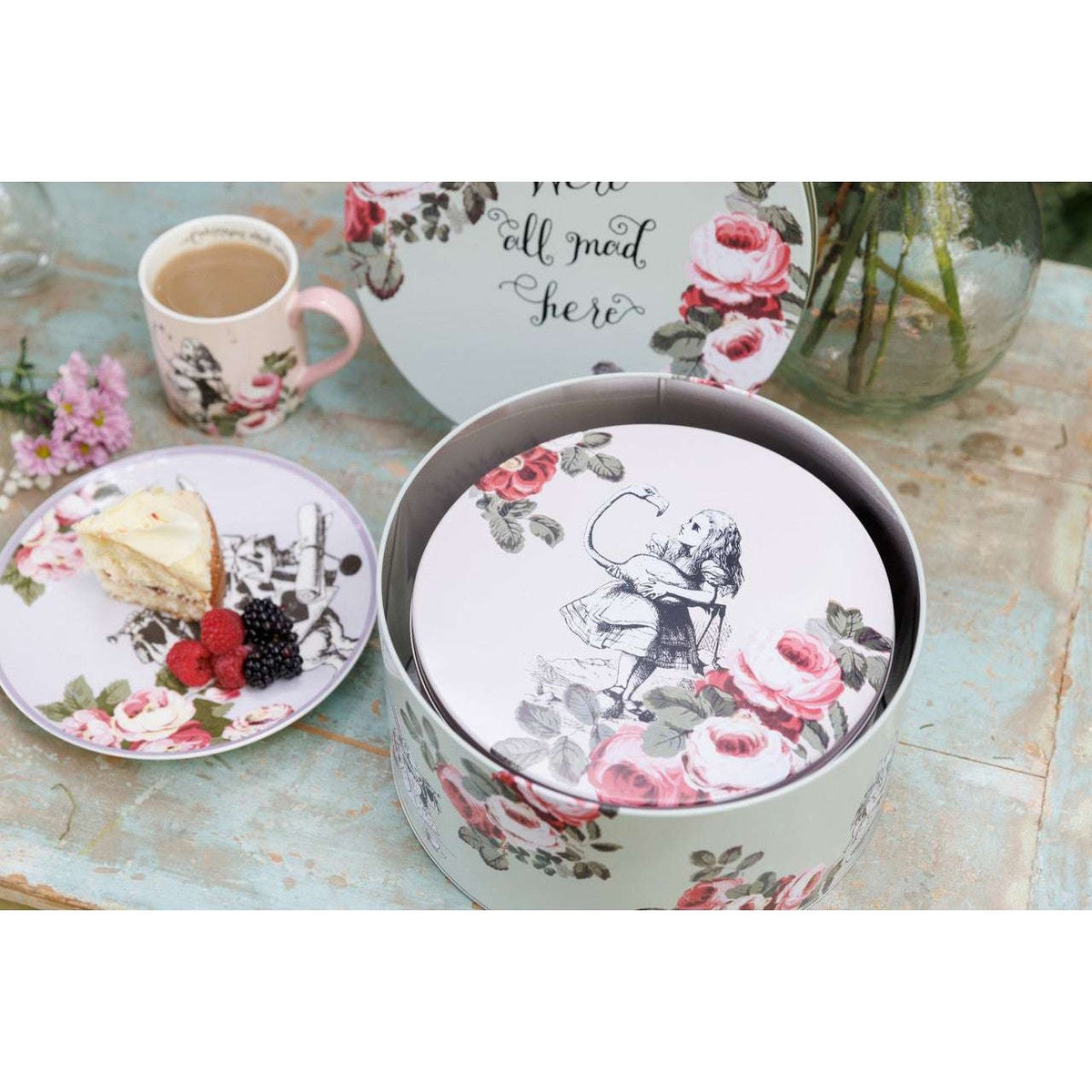 Close-up of the secure lids on Mikasa and V&A Alice In Wonderland Cake Tins, ensuring freshness for your baked treats.