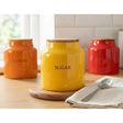Set of 3 Tomato Ceramic Tea Coffee Sugar Canisters, featuring a glossy finish, ideal for keeping your kitchen tidy.