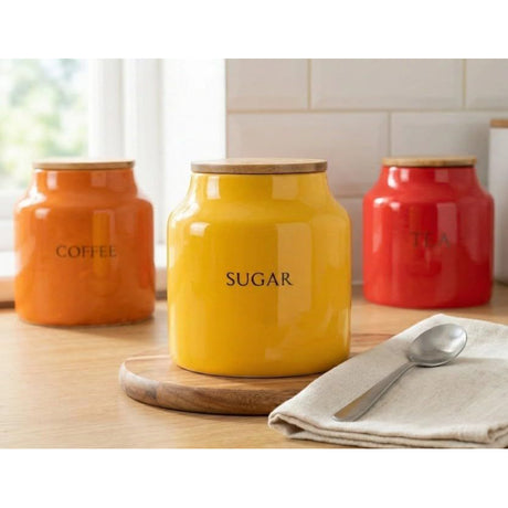 Set of 3 Tomato Ceramic Tea Coffee Sugar Canisters, featuring a glossy finish, ideal for keeping your kitchen tidy.