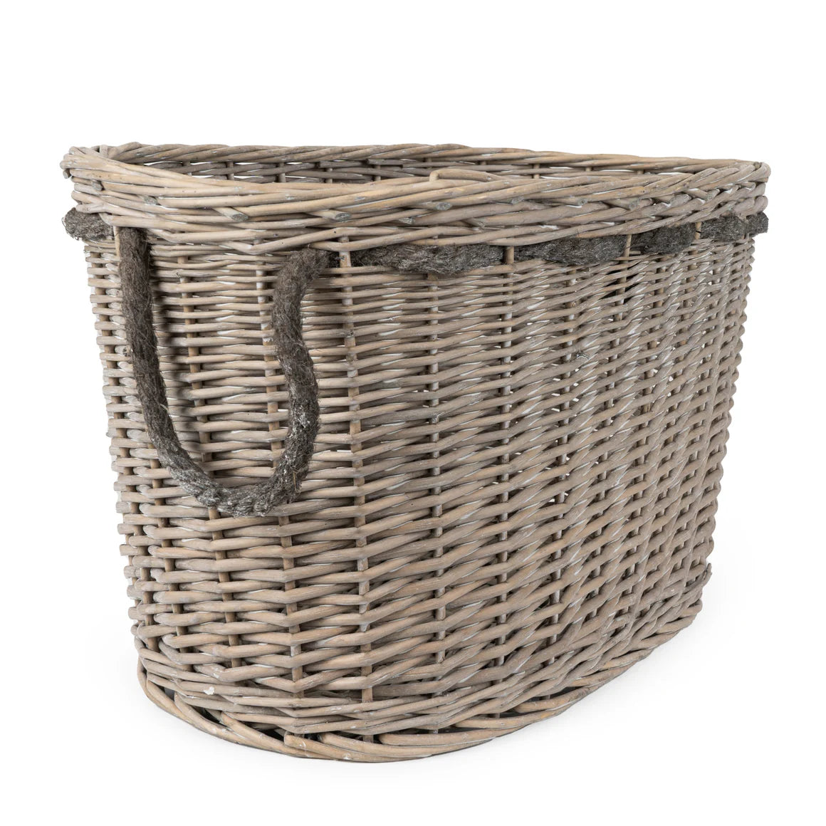 Luxurious oval log basket showcasing intricate design, great for a cozy fireplace setting.