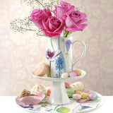 Charming Portmeirion Water Garden Cake Stand displaying an artistic floral print, the perfect floral cake stand for dessert presentations.