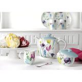 Beautifully arranged Portmeirion Water Garden 3 Piece Teapot Set, perfect for an inviting afternoon tea setting.